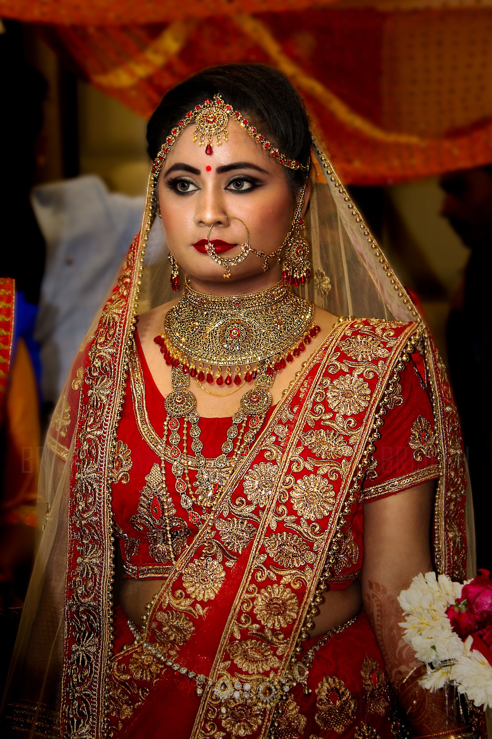 Richly embroidered bridal silk saree with temple jewelry